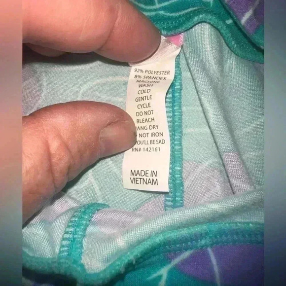 Lularoe one size Disney Minnie Mouse leggings in turquoise, purple, and white. - Picture 3 of 4